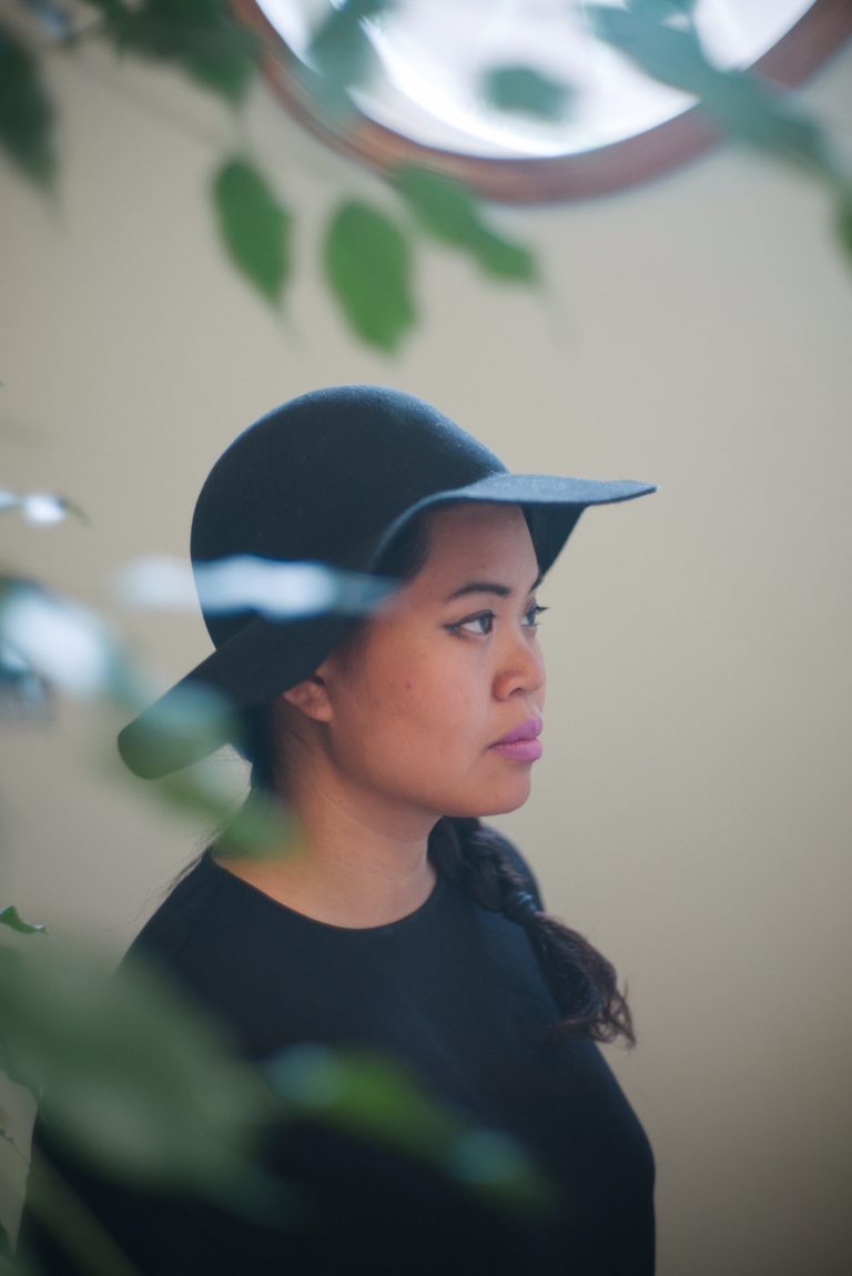 Portrait of Patricia Nguyen surrounded by plants