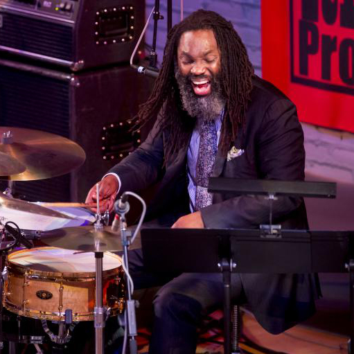 Dana Hall plays the drums enthusiastically